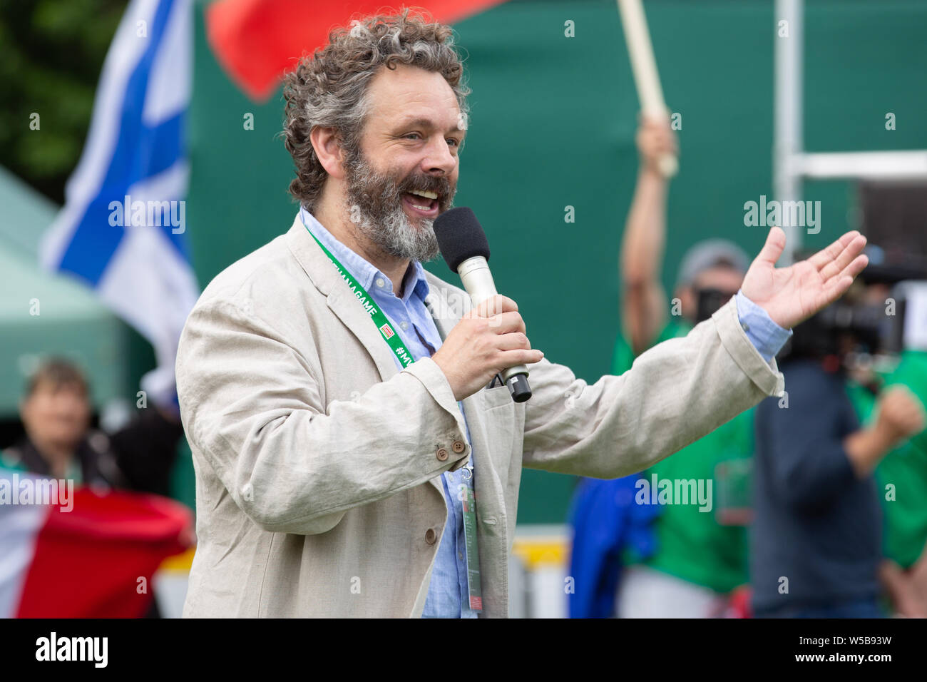 Cardiff, Wales. 27th July, 2019. Michael Sheen at the Homeless World Cup Opening Ceremony. Football teams from more than 50 countries compete in the Homeless World Cup at Cardiff's iconic Bute Park, Wales, UK Credit: Tracey Paddison/Alamy Live News Stock Photo