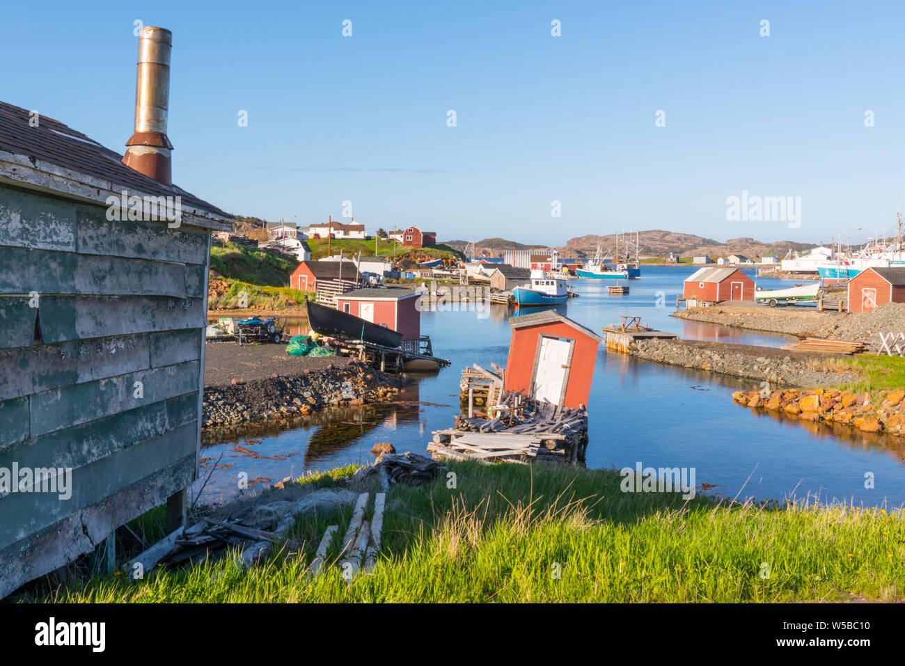 Boats and sheds in the harbor of Farmers Arm near Jenkins Cove, Newfoundland, Canada Stock Photo