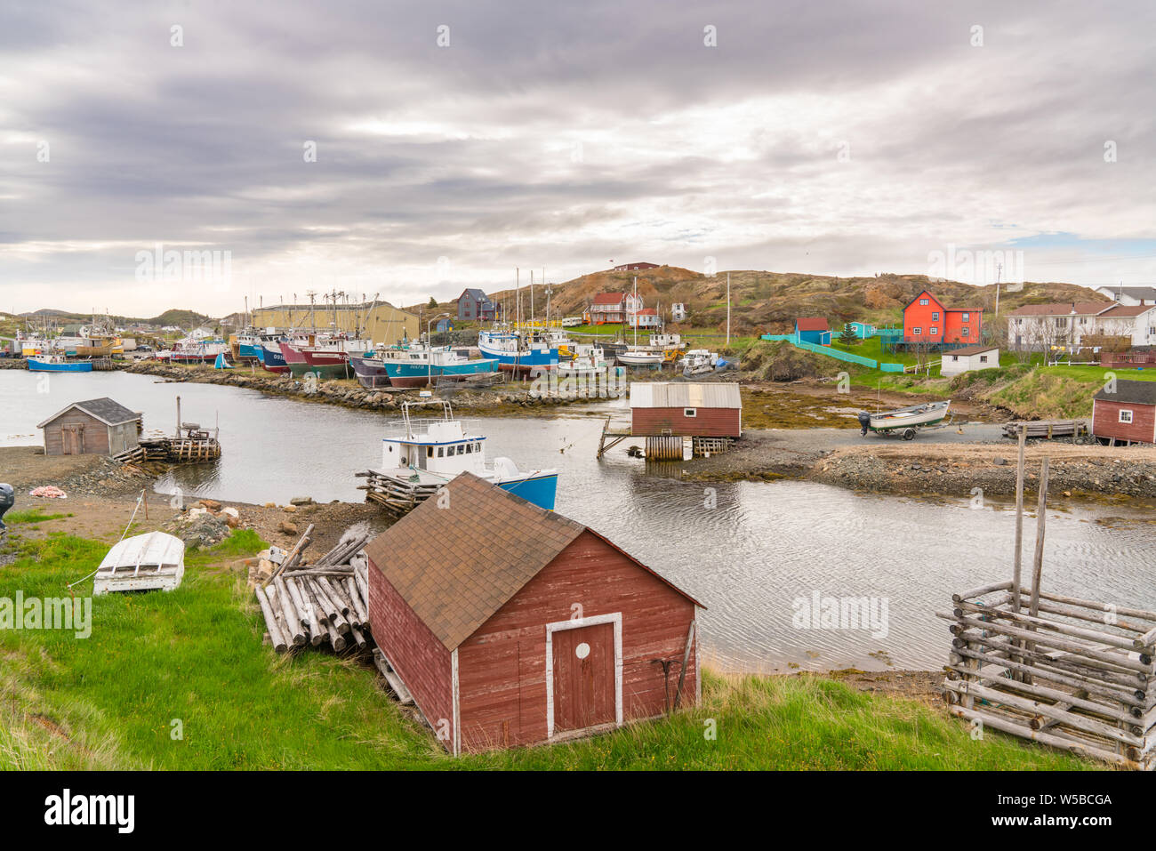 Jenkins Cove, Newfoundland - June 13, 2019: Boats and sheds in the harbor of Farmers Arm near Jenkins Cove, Newfoundland, Canada Stock Photo
