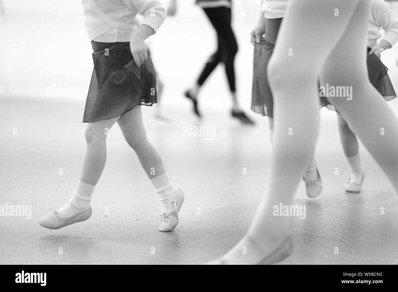 Little children are engaged in a dance studio with a choreographer. Stock Photo