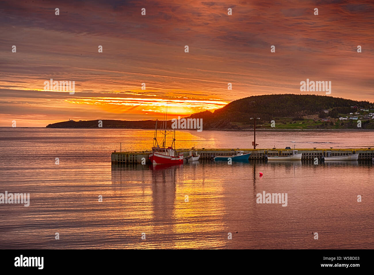 Sunset In Rocky Harbour with fishing boats, Newfoundland, Canada Stock