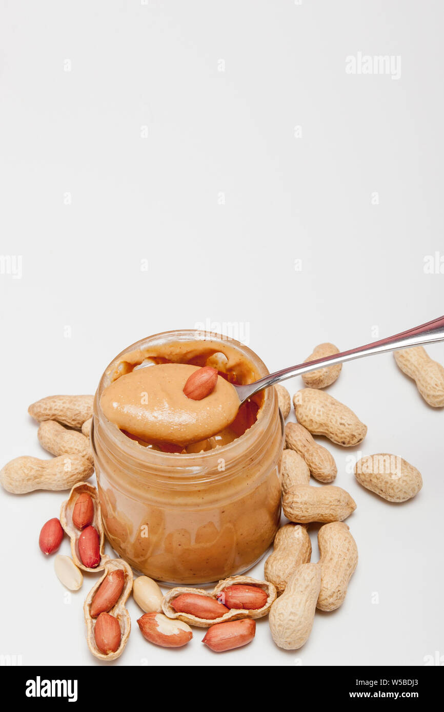 https://c8.alamy.com/comp/W5BDJ3/creamy-peanut-butter-in-glass-jar-peanut-and-spoon-isolated-on-white-background-a-traditional-product-of-american-cuisine-W5BDJ3.jpg