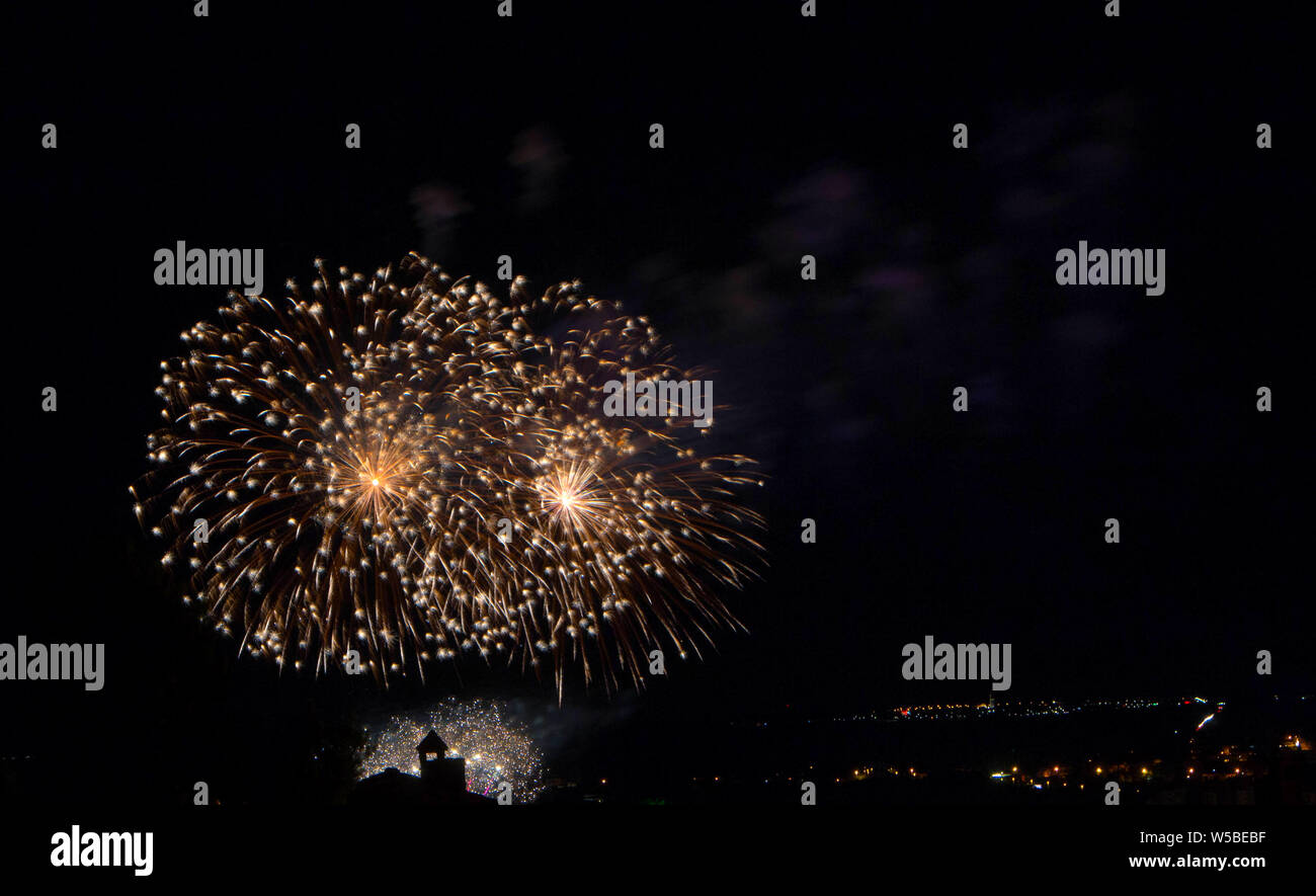 Abstract colored firework against a black background with free space for text Stock Photo