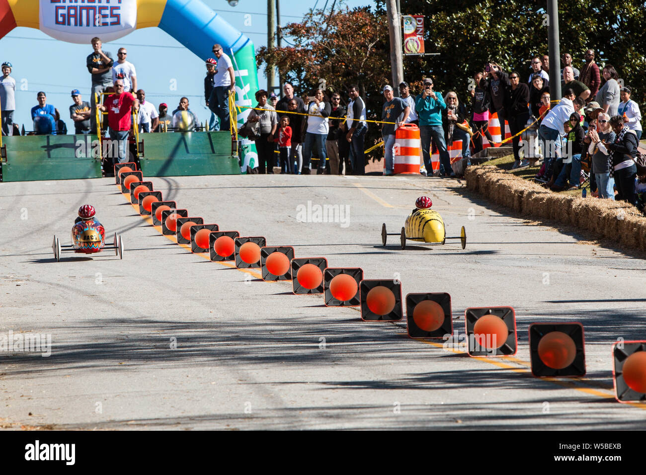 Two child competitors race their soap box derby vehicles in a close race at the Georgia Gravity Games on November 3, 2018 in Douglasville, GA. Stock Photo
