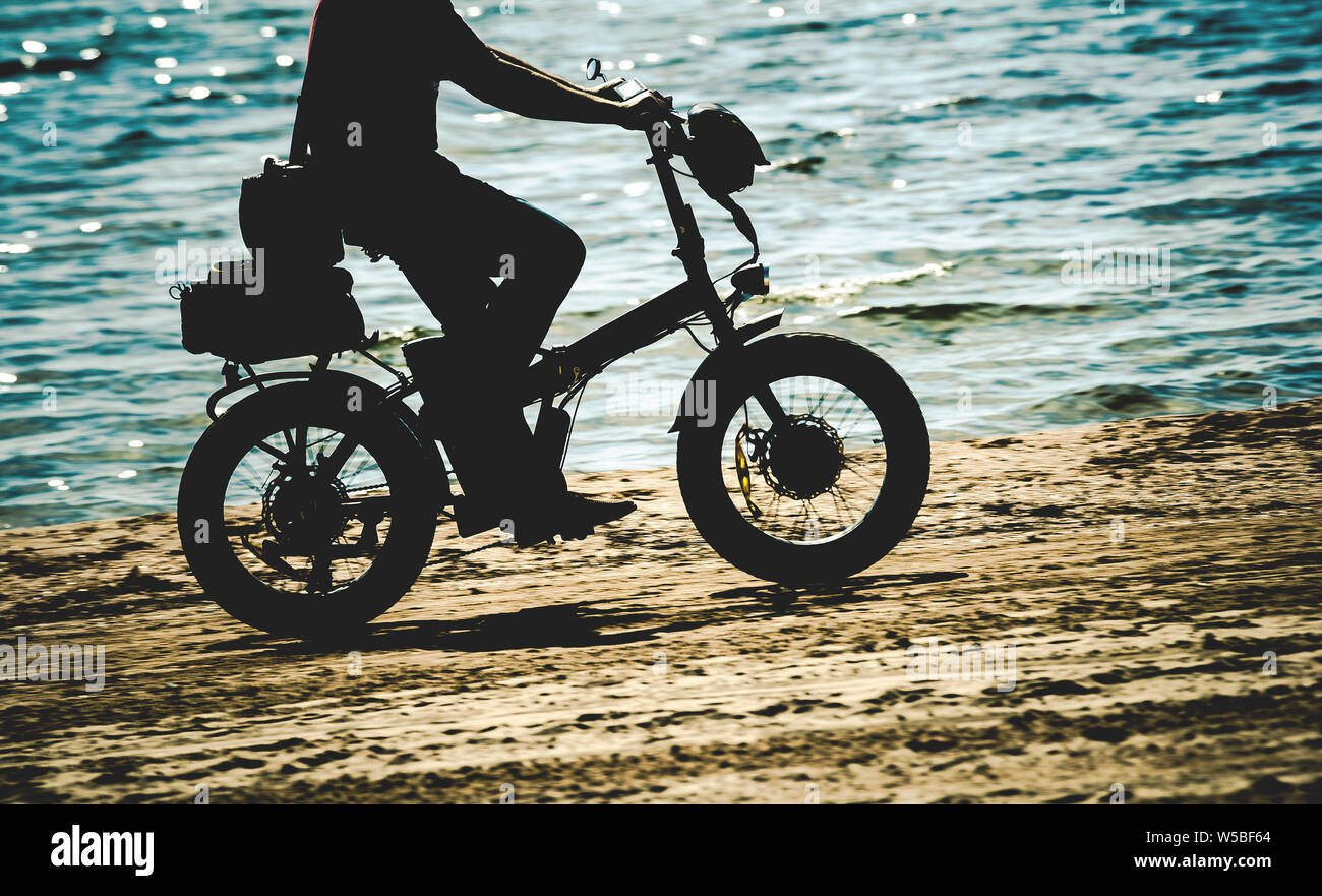 electric bike on sea beach Stock Photo Alamy