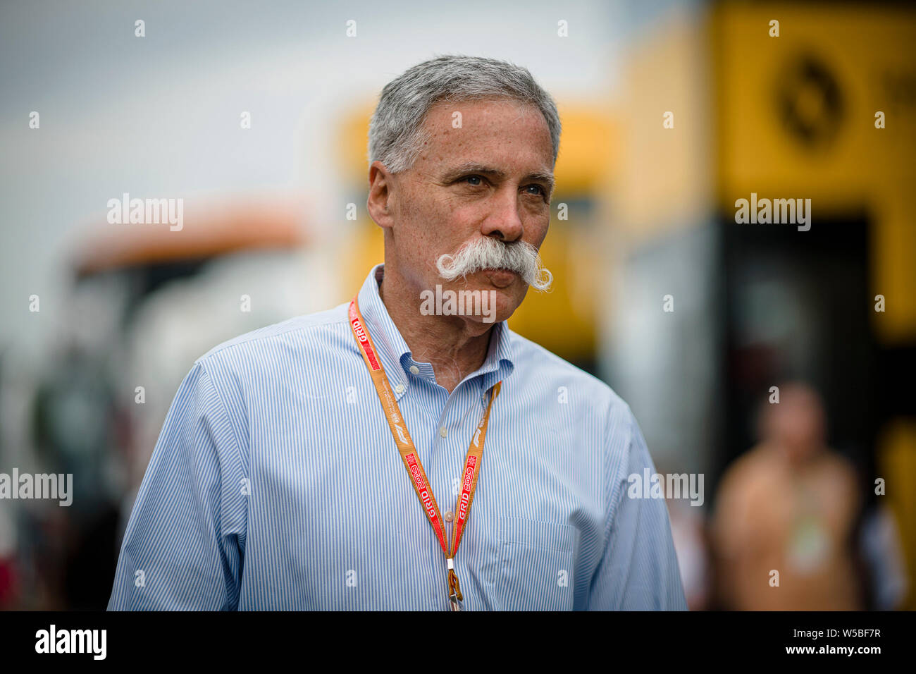 Chief Executive Officer of the Formula One Group Chase Carey walks