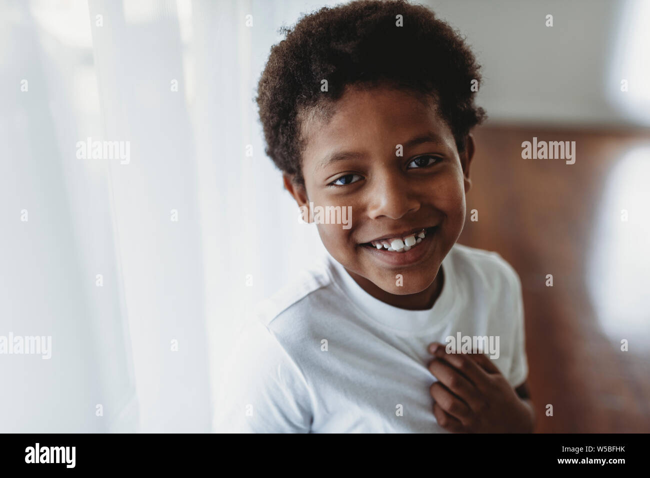 Preteen boy smiling camera hi-res stock photography and images - Alamy