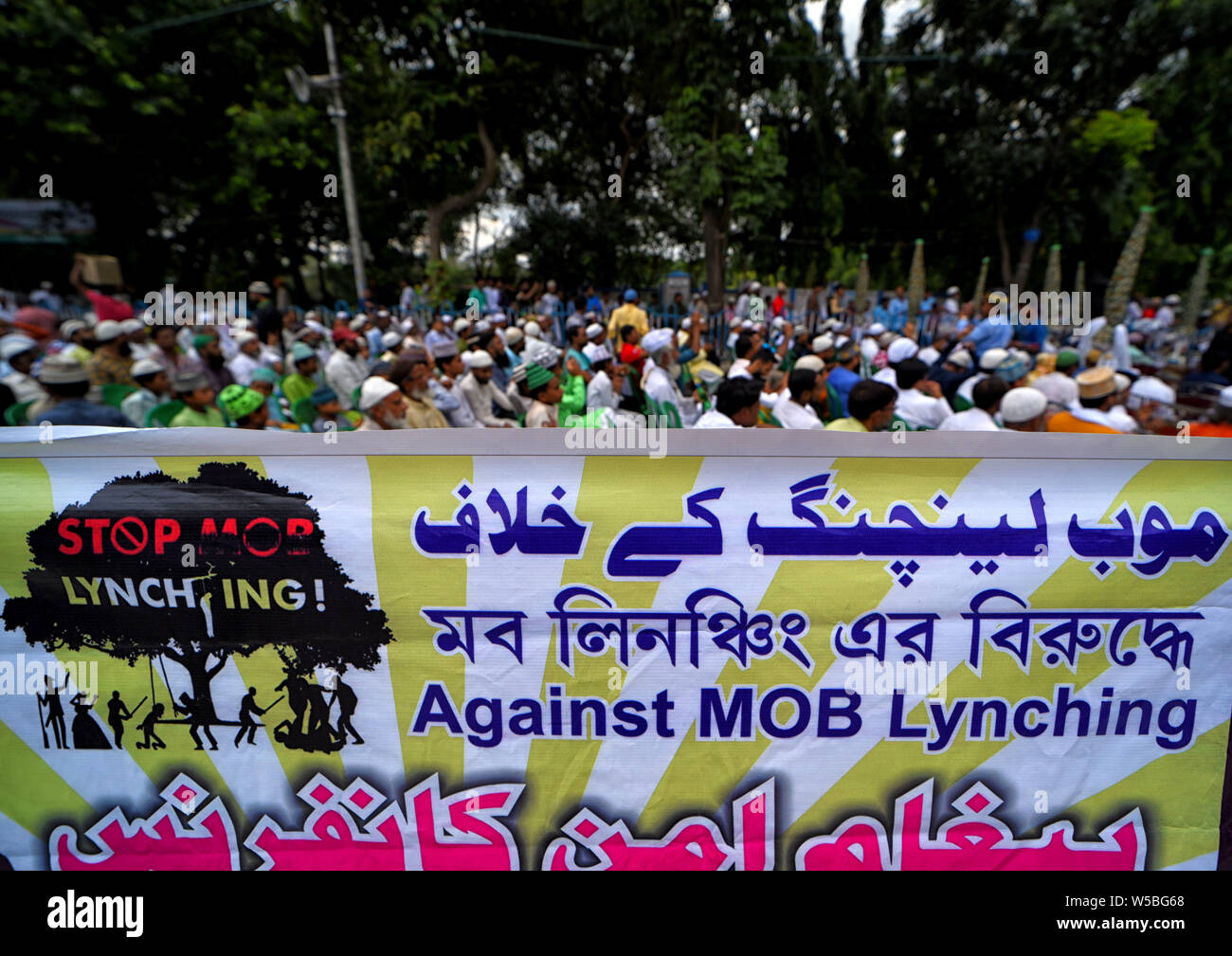 Protesters from the different Minority community of India hold a banner during the Mob Lynching Protest in Kolkata.Protest against the recent Mob lynching incidents at different part of India, in 2019 hate crimes in the name of religion are constantly increasing and disturbing communal harmonies of the country at different states. Stock Photo
