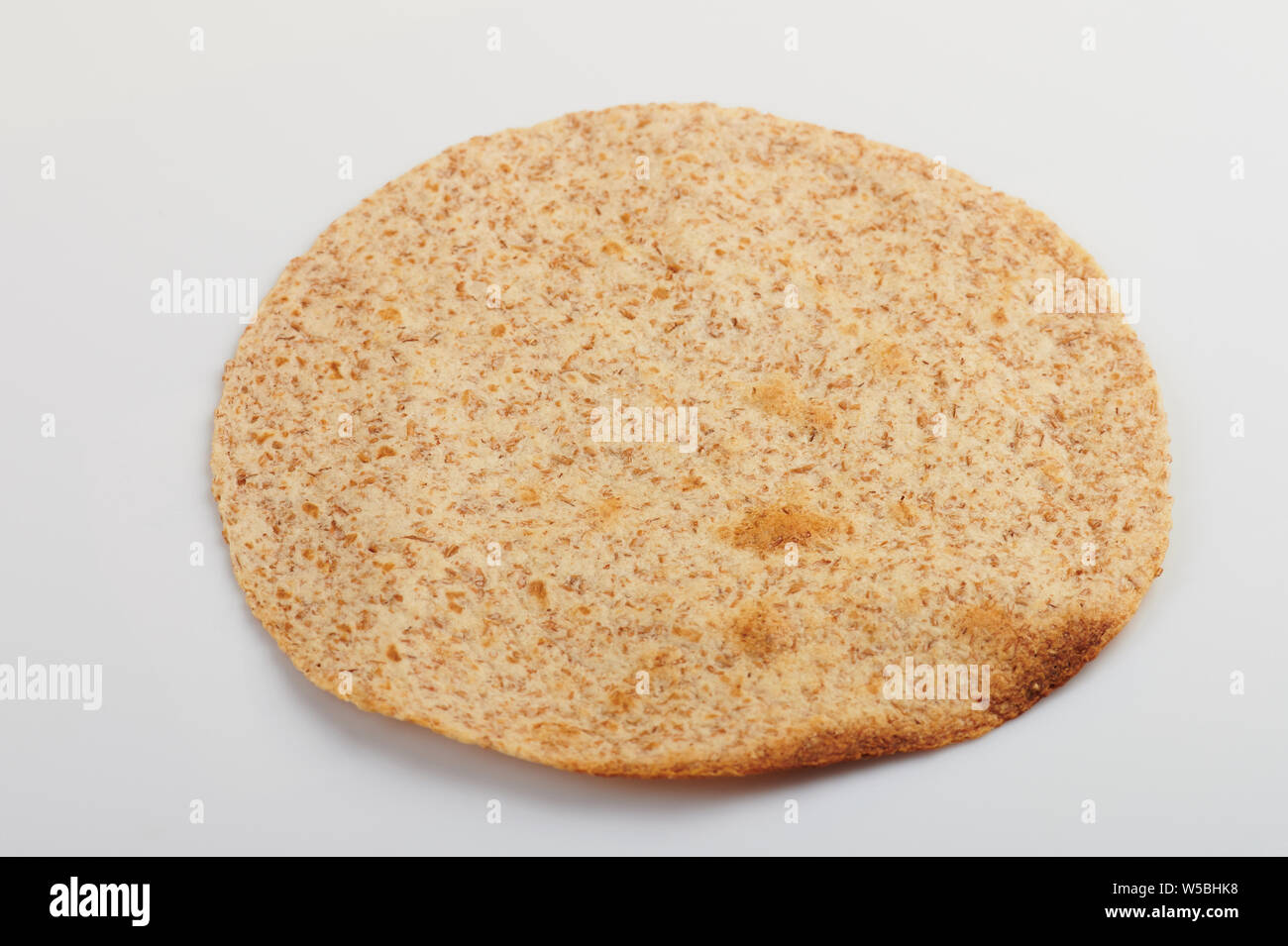 Angle view of one toasted tortilla isolated on white background Stock Photo
