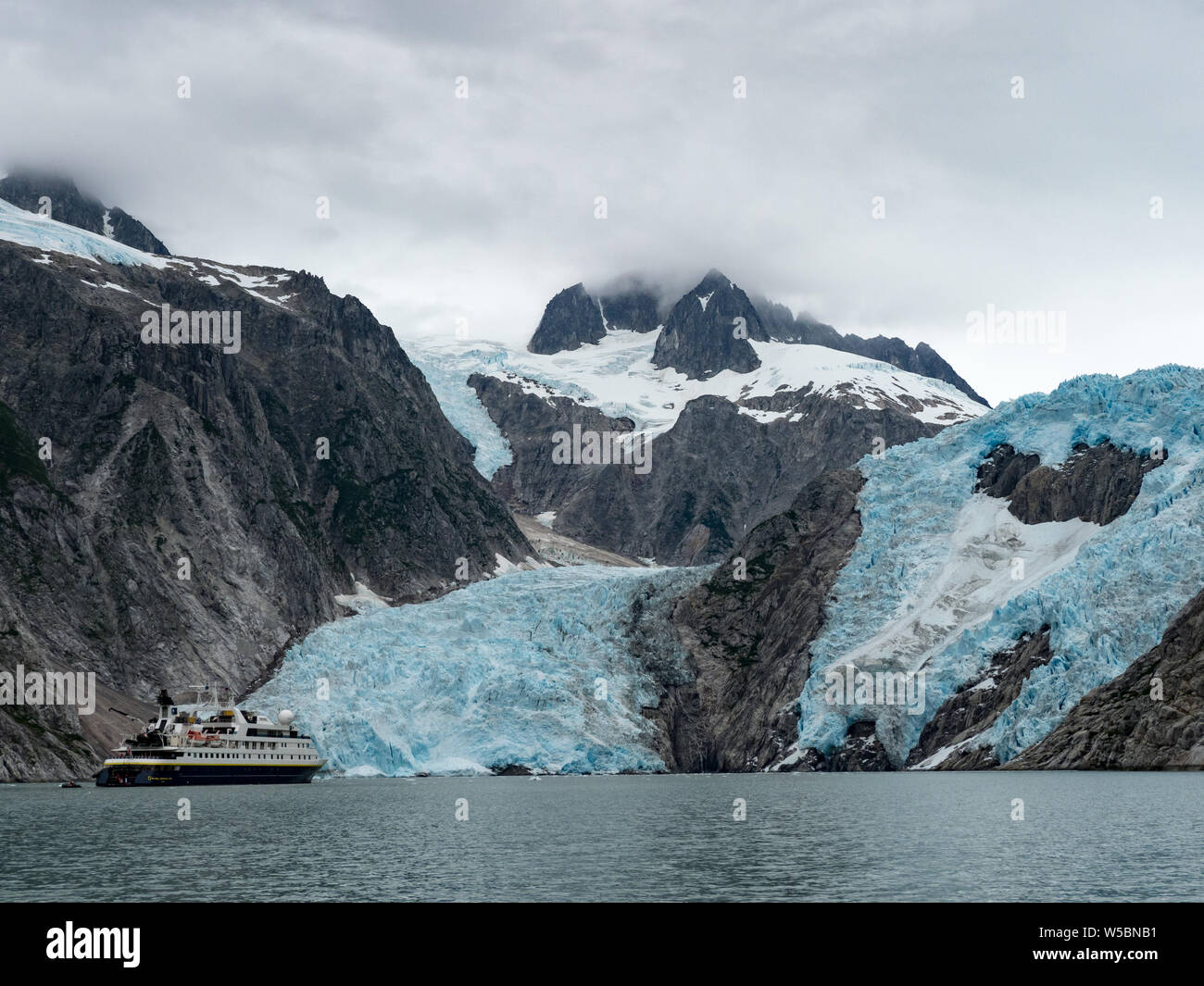 Exploring the Northwestern Glacier on board the National Geographic Orion in Kenai Fjords National Park, Alaska, USA Stock Photo