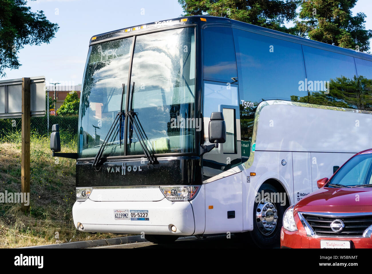 June 26, 2019 Fremont / CA / USA - Facebook shuttle bus taking employees from the East San Francisco bay area to the Company's headquarters in Menlo P Stock Photo