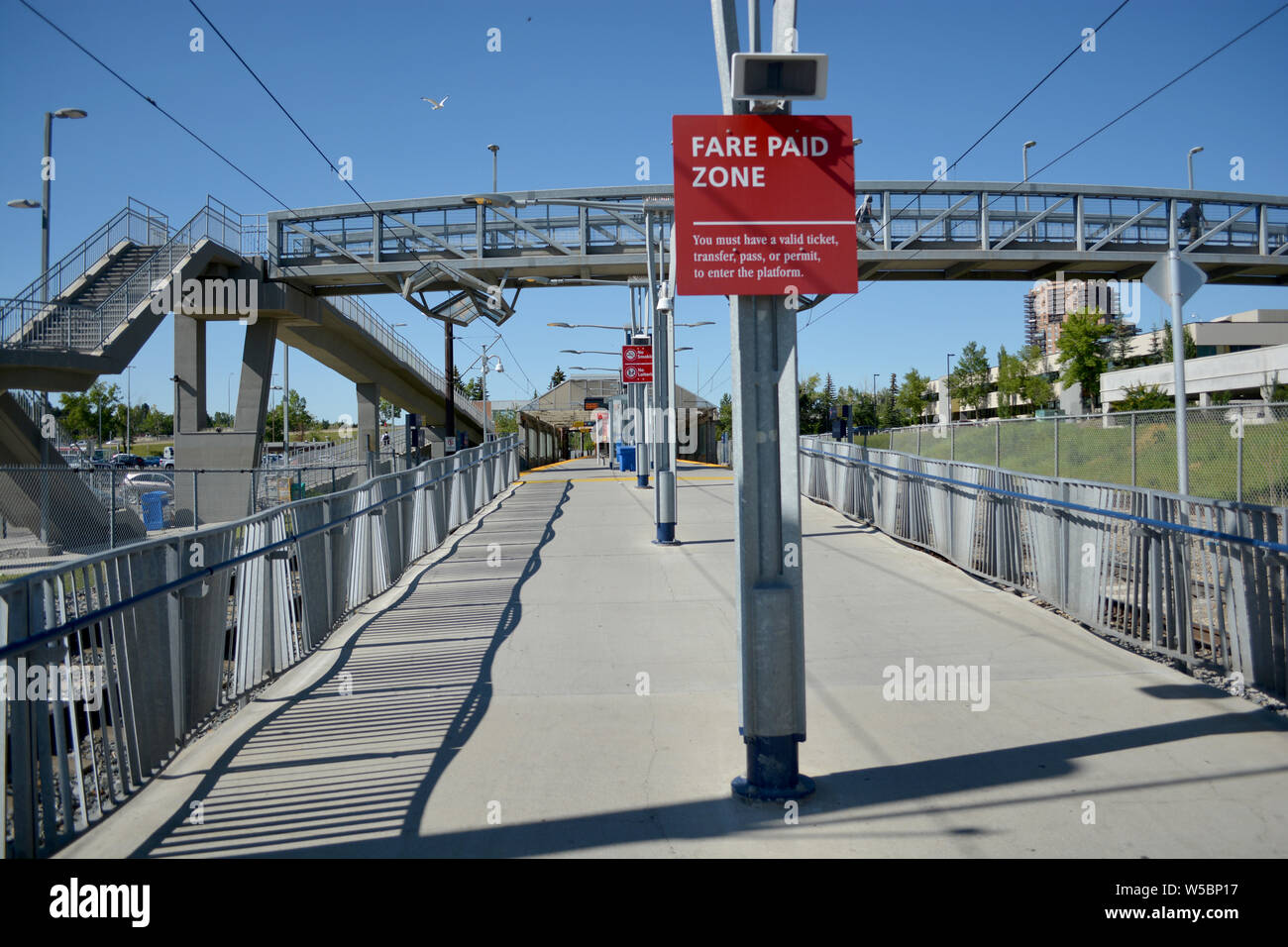 Pedestrian transit train track line at city station. Stock Photo