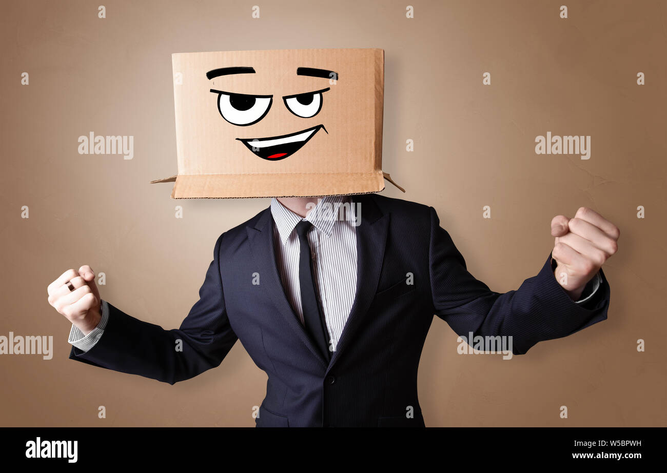 Young man with happy face illustrated cardboard box on his head Stock ...