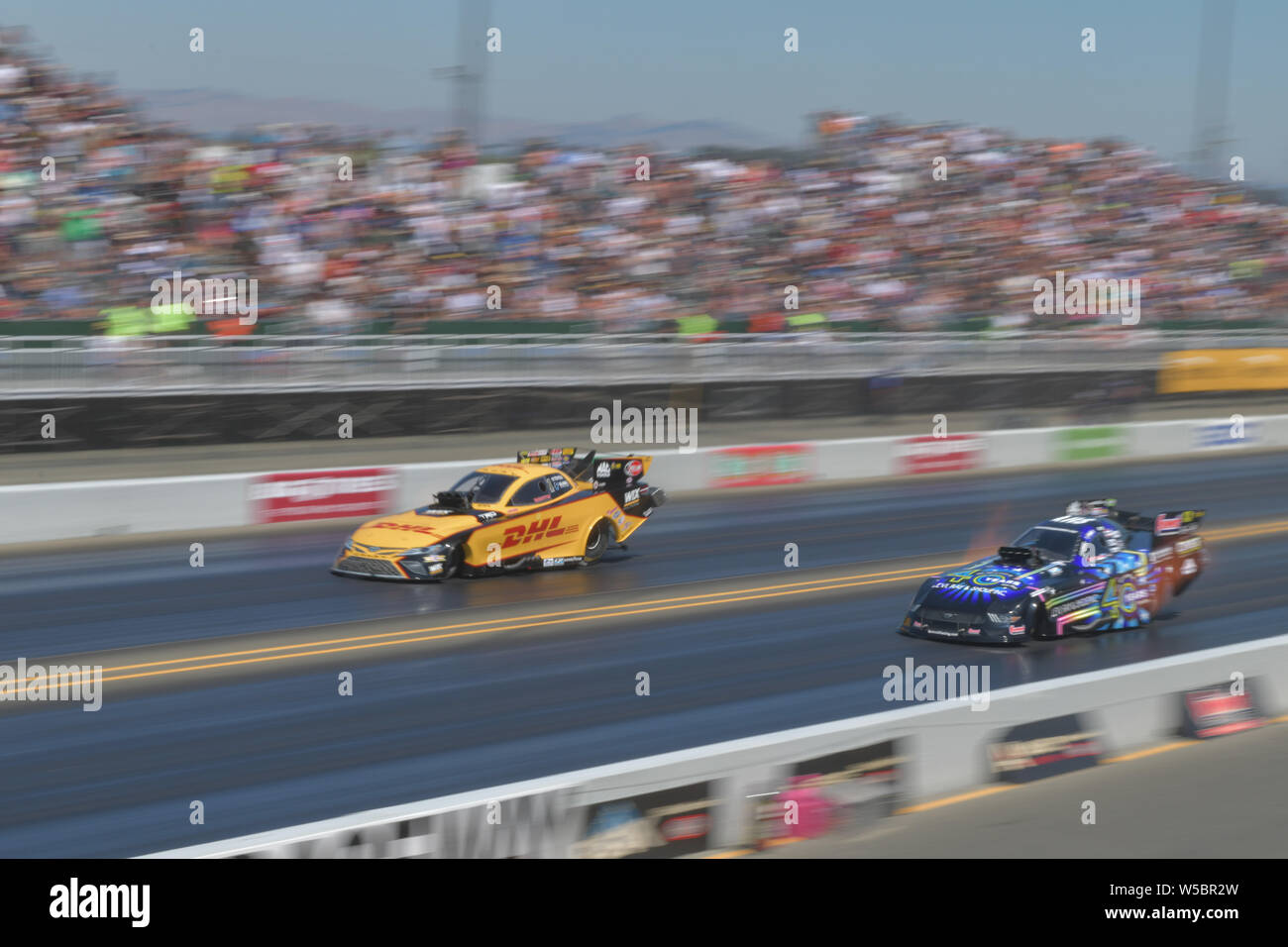 Sonoma, California, USA. 27th July, 2019. J.R. Todd in the DHL car runs against Tom Wilkerson during the NHRA Sonoma Nationals at Sonoma Raceway in Sonoma, California. Chris Brown/CSM/Alamy Live News Stock Photo