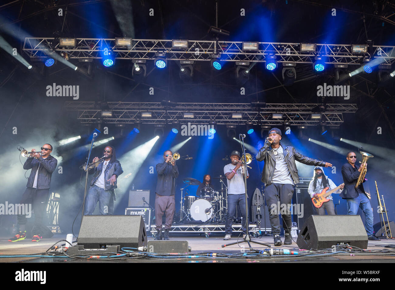 Standon, UK. Saturday 27 July 2019.  Hypnotic Brass Ensemble performs at Standon Calling set in the picturesque grounds of Standon Lordship © Jason Richardson / Alamy Live News Stock Photo