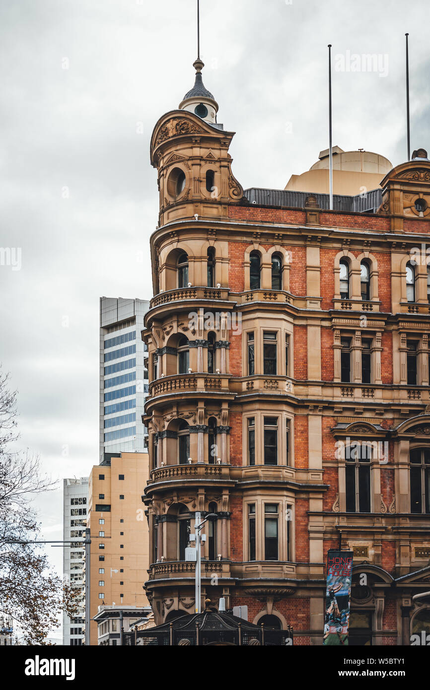 Sydney CBD, New South Wales - JUNE 23rd, 2019: Old brick and sandstone building next to the Queen Victoria Building on York and Druitt Streets. Stock Photo