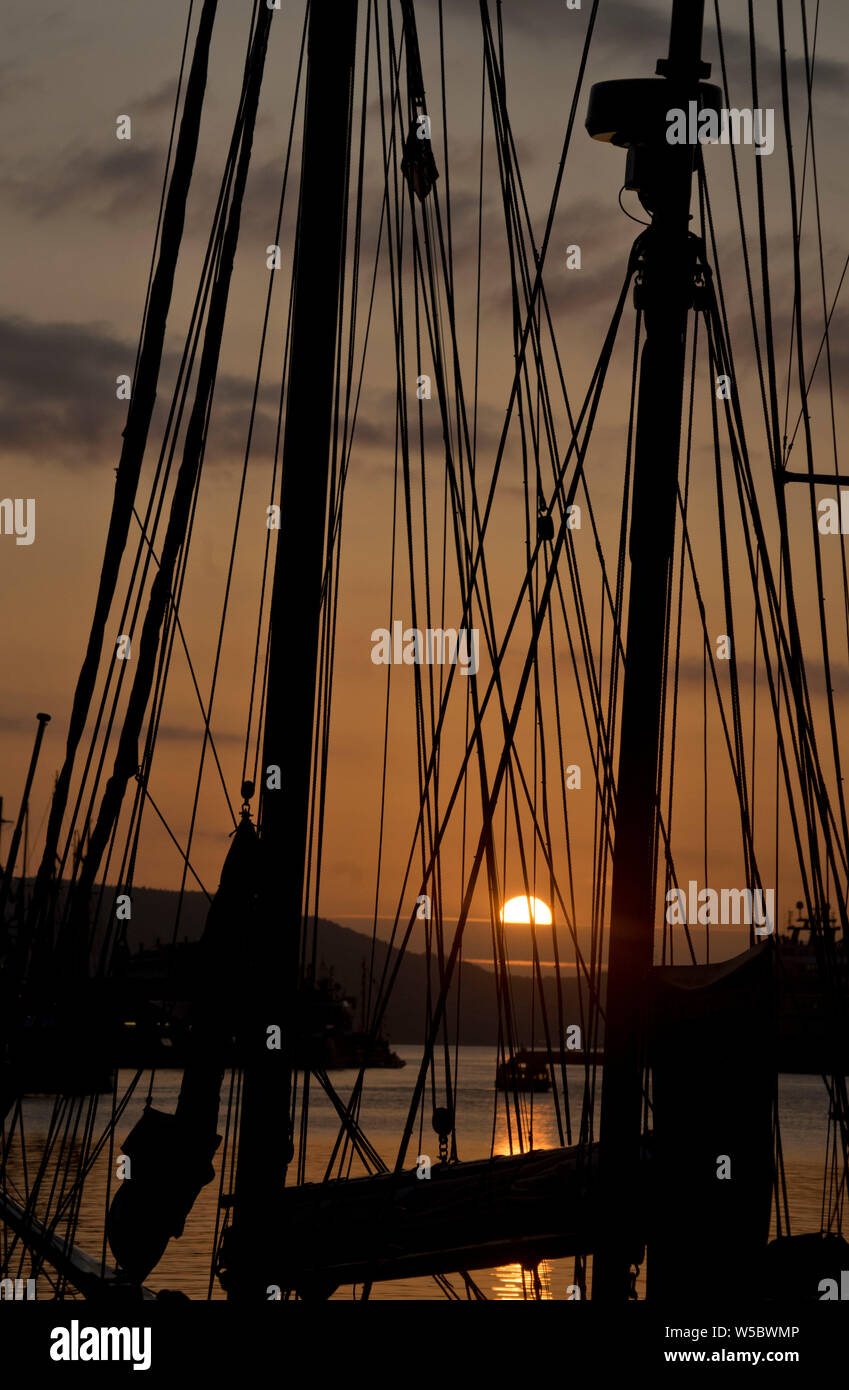 Sunset with ships at Bergen harbour in Norway in preparations for the Tall Ships Races, attracting a fleet of 70 vessels from 20 countries. Bergen,Nor Stock Photo