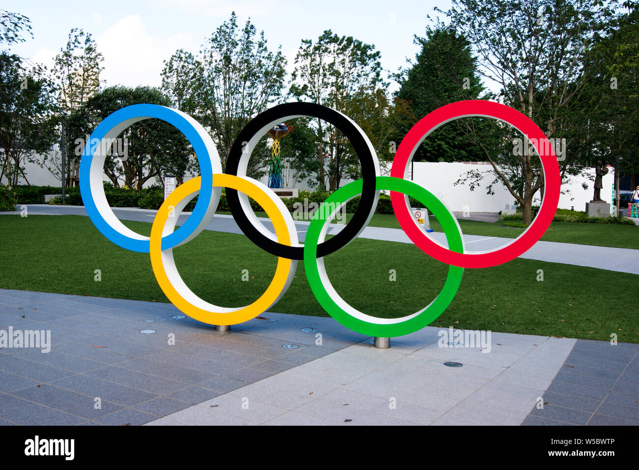 Tokyo, Japan. Olympic rings in front of the new national stadium of Tokyo in representation of the 2020 olympics. Stock Photo