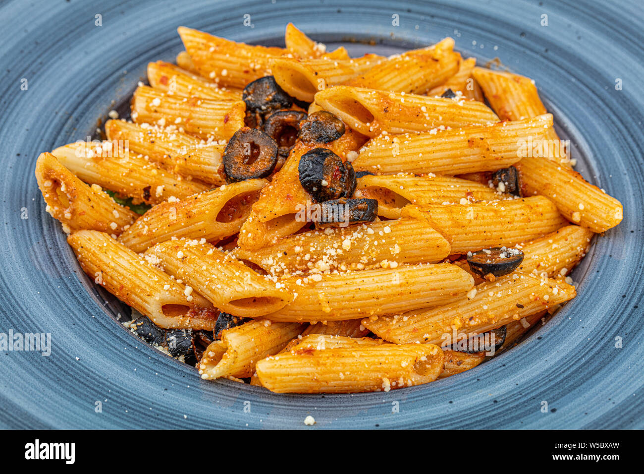 Italian Penne pasta in tomato sauce with arrabiata. Pasta concept Stock