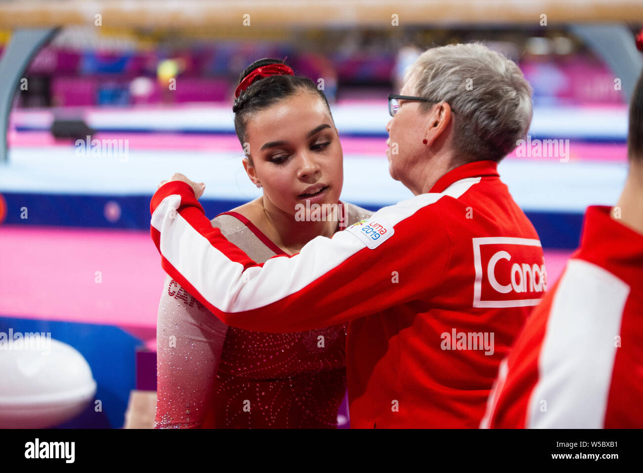 Lima, Peru. 27th July, 2019. Brooklyn Moors (#14) with her Coach during the Pan American Games Women's Artistic Gymnastics, Qualification and Team Final at Polideportivo Villa el Salvador in Lima, Peru. Daniel Lea/CSM/Alamy Live News Stock Photo
