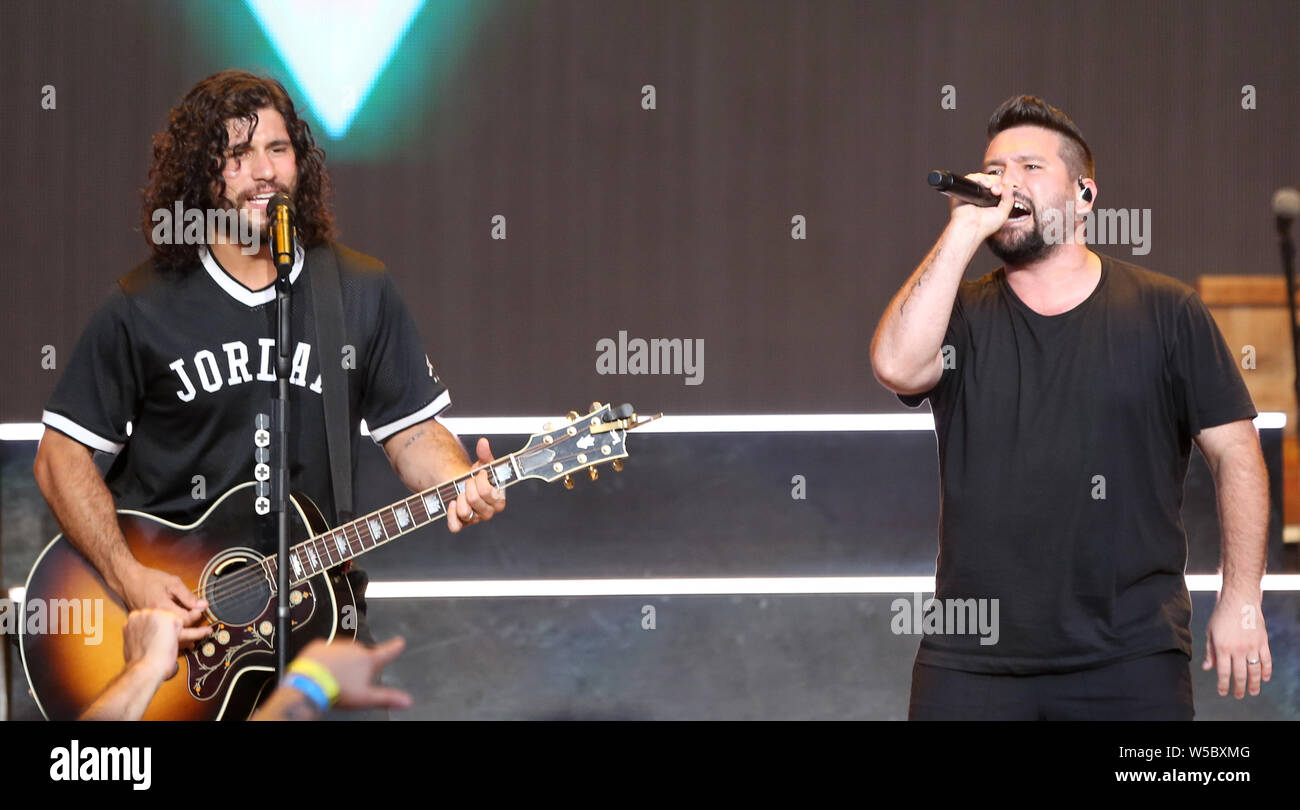 WANTAGH, NY - JUL 20: Dan Smyers (L) and Shay Mooney of Dan + Shay perform in concert on July 20, 2019 at Jones Beach in Wantagh, New York. Stock Photo