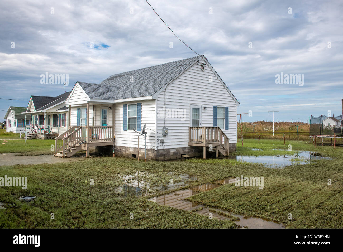 A house on Tangier Island with a flooded yard Stock Photo Alamy