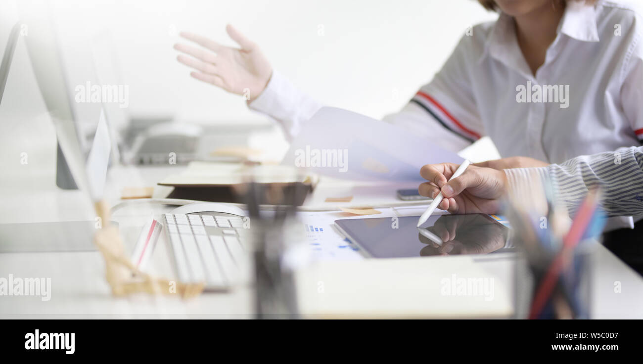 UI UX website development team sketching wireframe layout for responsive web content in studio Stock Photo