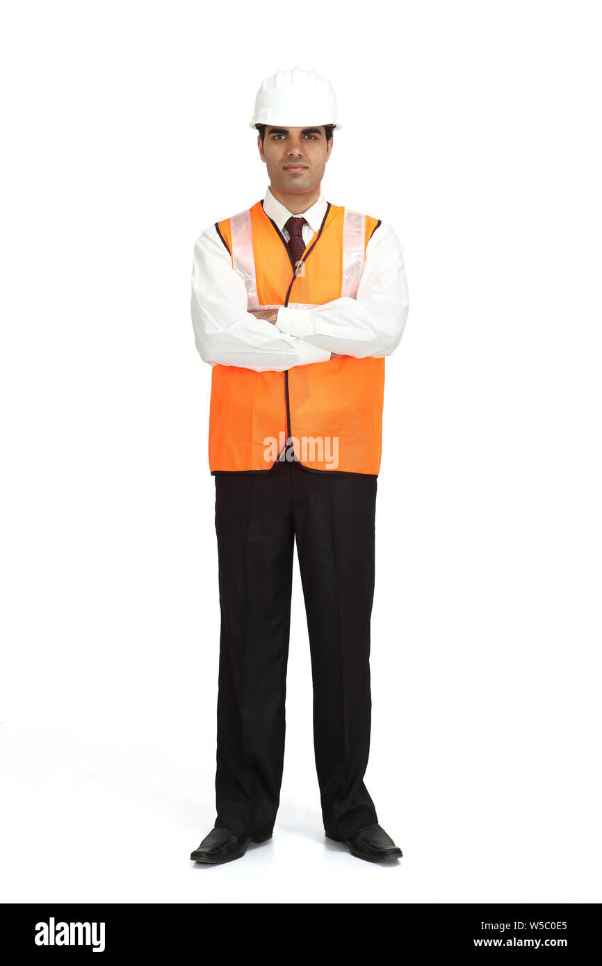 Architect standing with his arms crossed Stock Photo