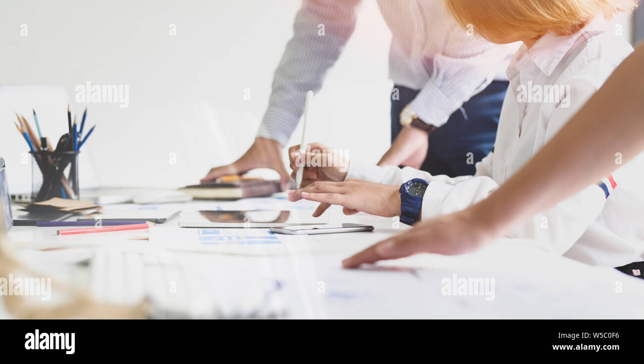 UI UX website development team sketching wireframe layout for responsive web content in studio Stock Photo