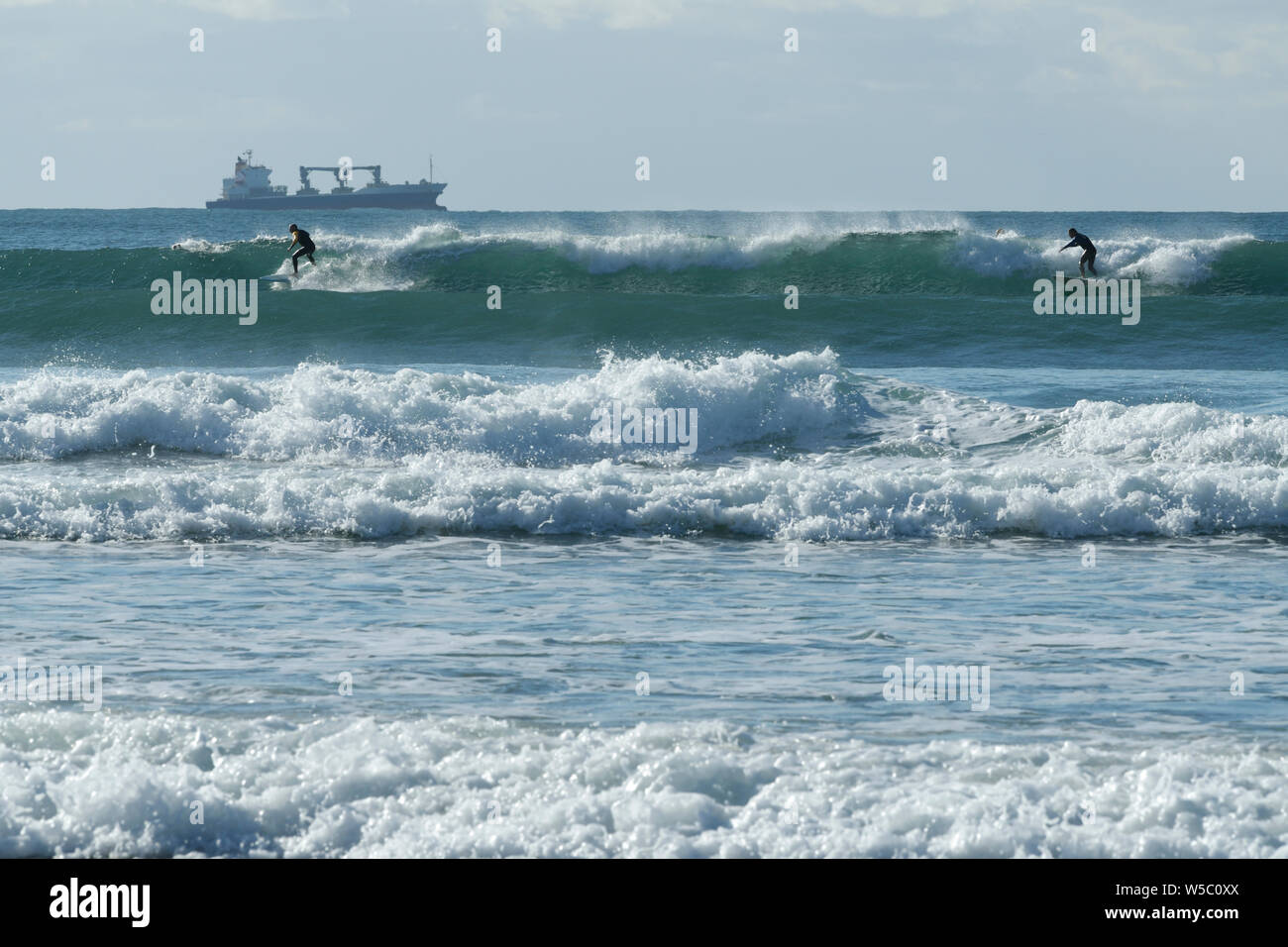 Durban, KwaZulu-Natal, South Africa, two male surfers surfing wave, Battery beach, city, landscape, sport, Africa, lifestyle, people Stock Photo