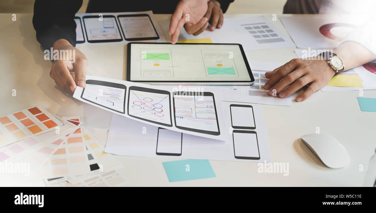 UX Graphic designer creative planning application process and development prototype wireframe for web or mobile smart phone Stock Photo