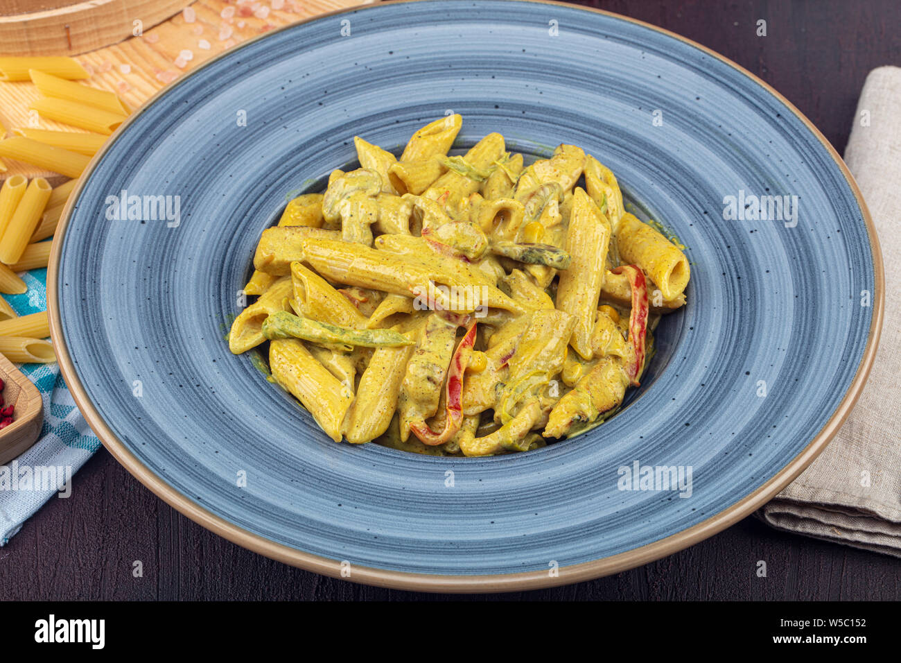 Penne pasta, pasta with curry sauce Italian food. Concept for a tasty and  healthy meal. Top view. Copy space Stock Photo - Alamy