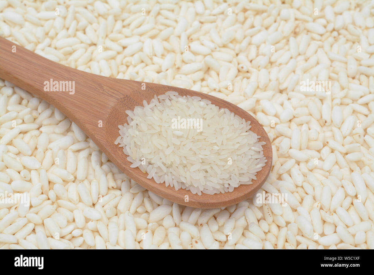 a spoon of rice on puffed rice cereal; background Stock Photo - Alamy