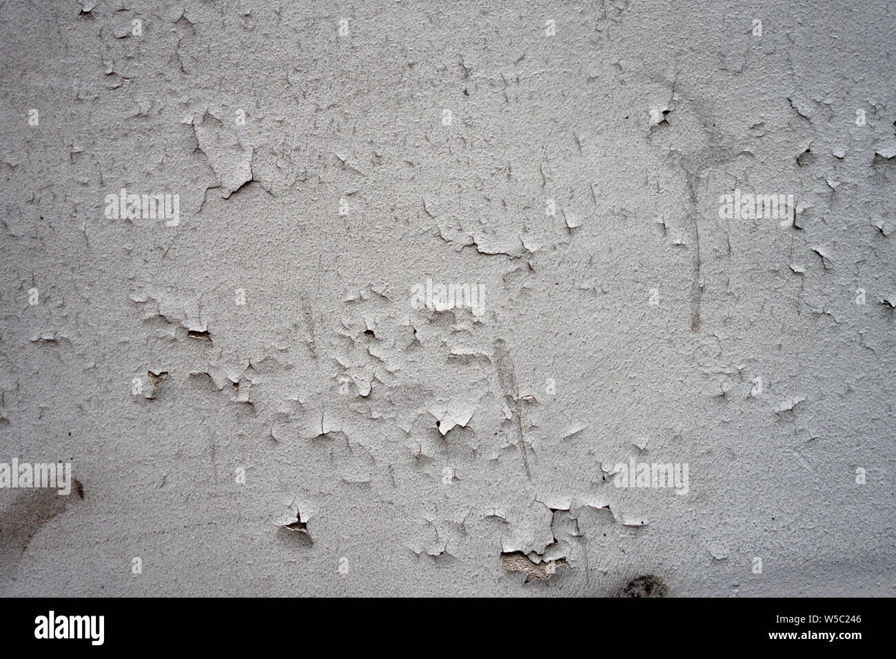 cracking paint on a white wall surface background Stock Photo Alamy