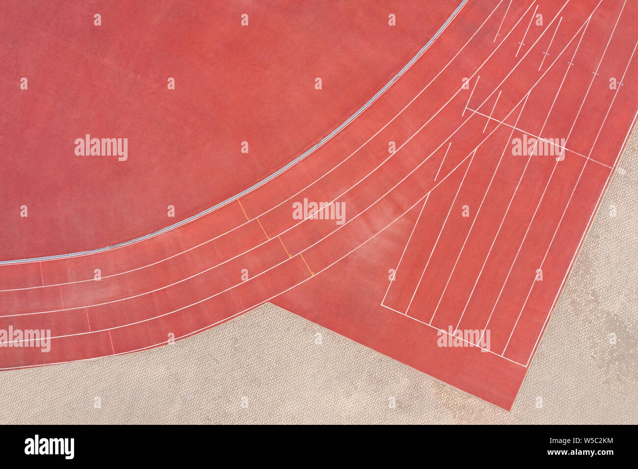 red synthetic rubber athletic running track on stadium. finish point