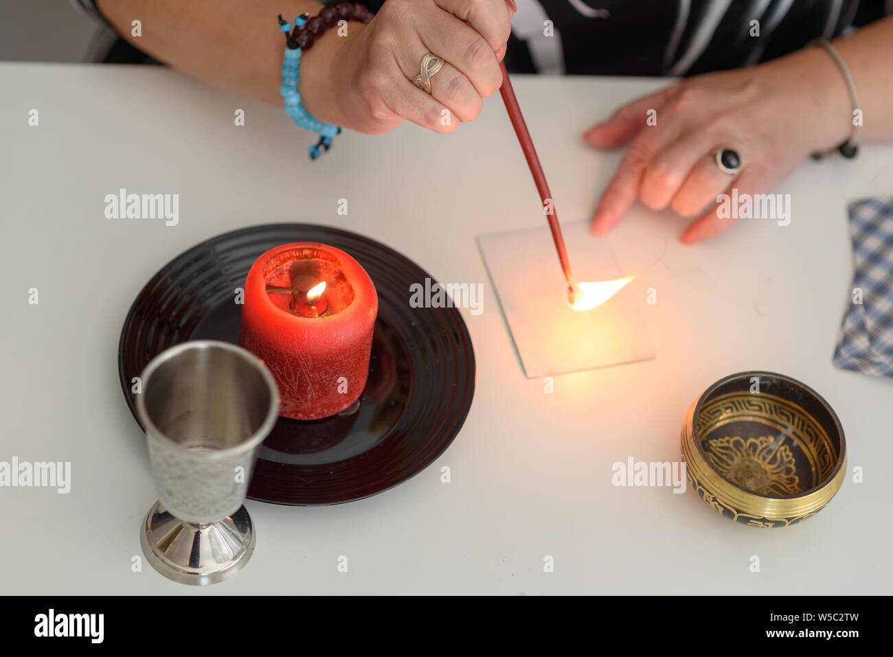 Fortune teller wonders on the candle, fortune teller make magic love spells. Mystical psychic, clairvoyance and divination. Stock Photo