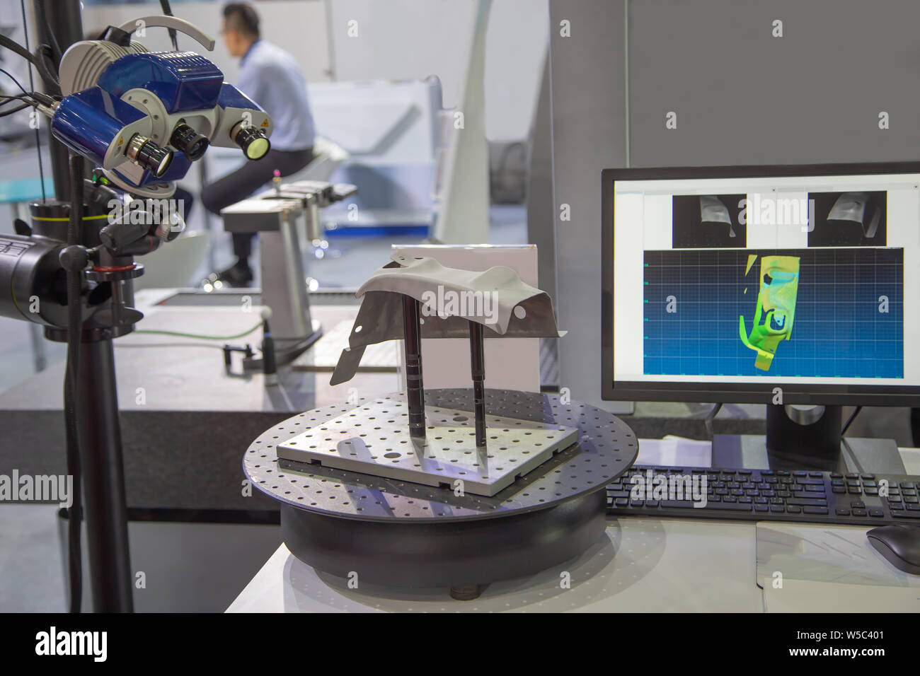 Optical 3D coordinate measuring machine scanning workpiece Stock Photo