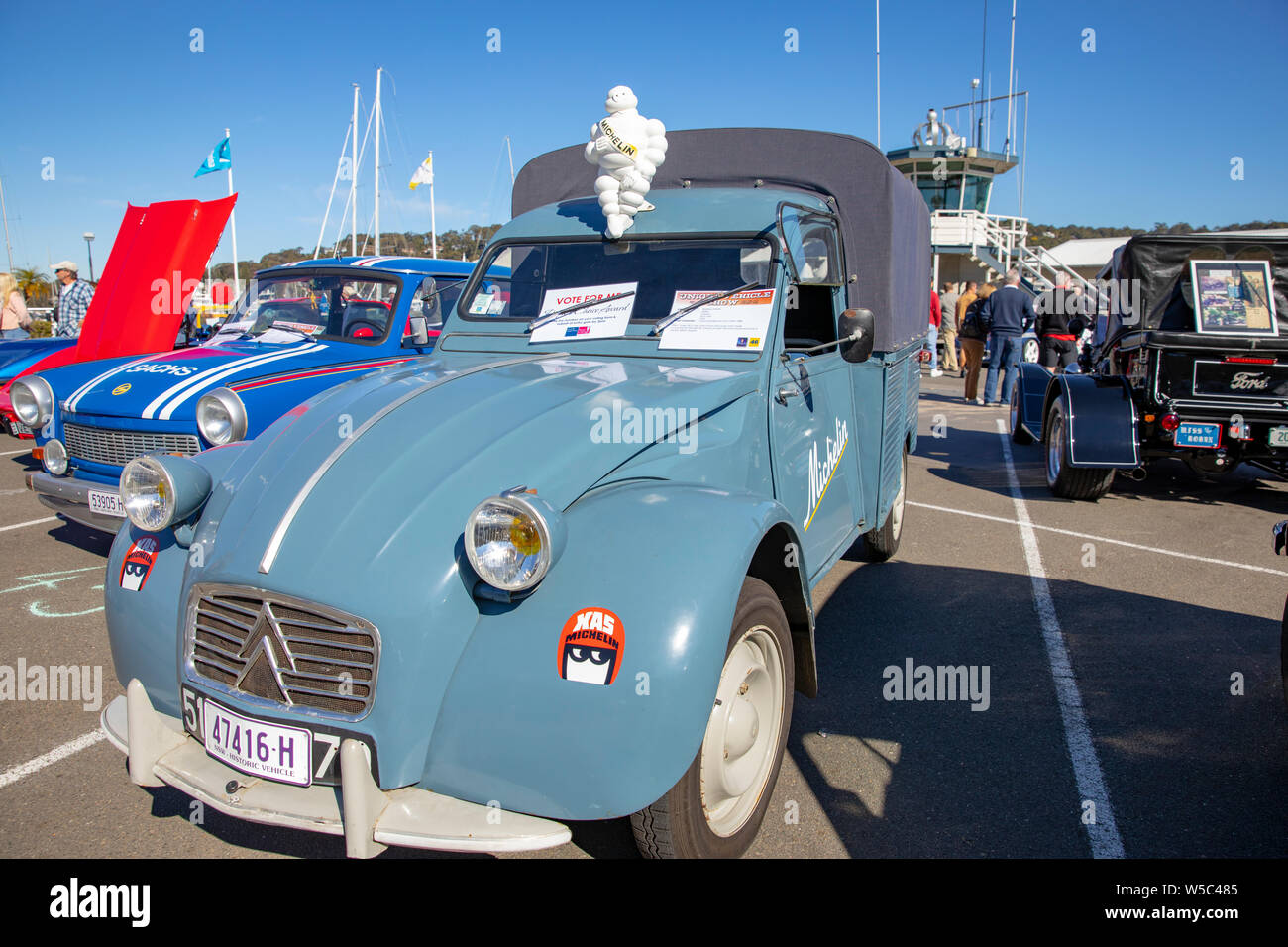Citreon 2cv van with classic michelin man mounted on the roof of the van at a Sydney classic car show,Australia Stock Photo