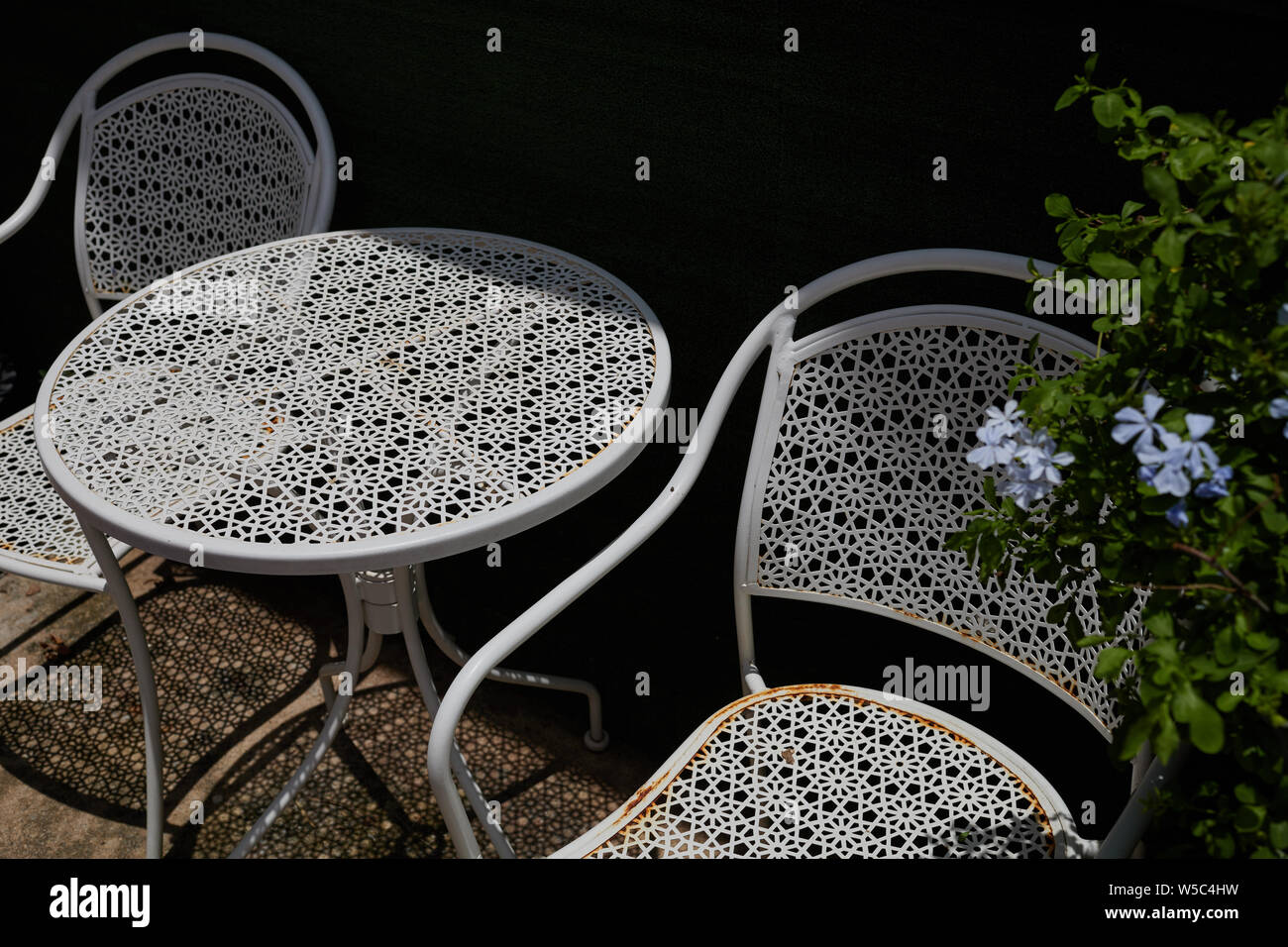 White metal outdoor furniture in backyard Stock Photo Alamy