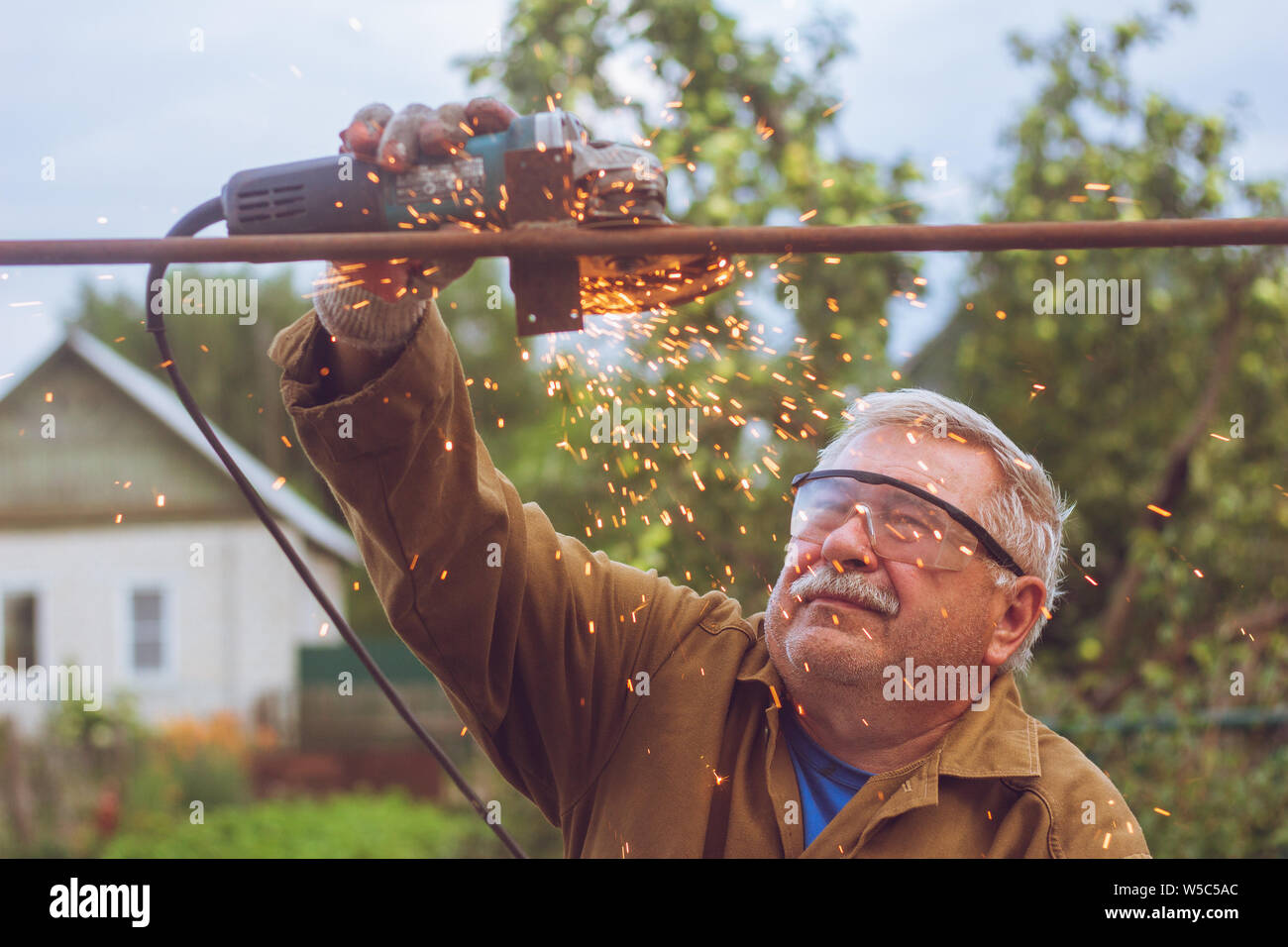 Man cuts metal grinder in hi-res stock photography and images - Alamy