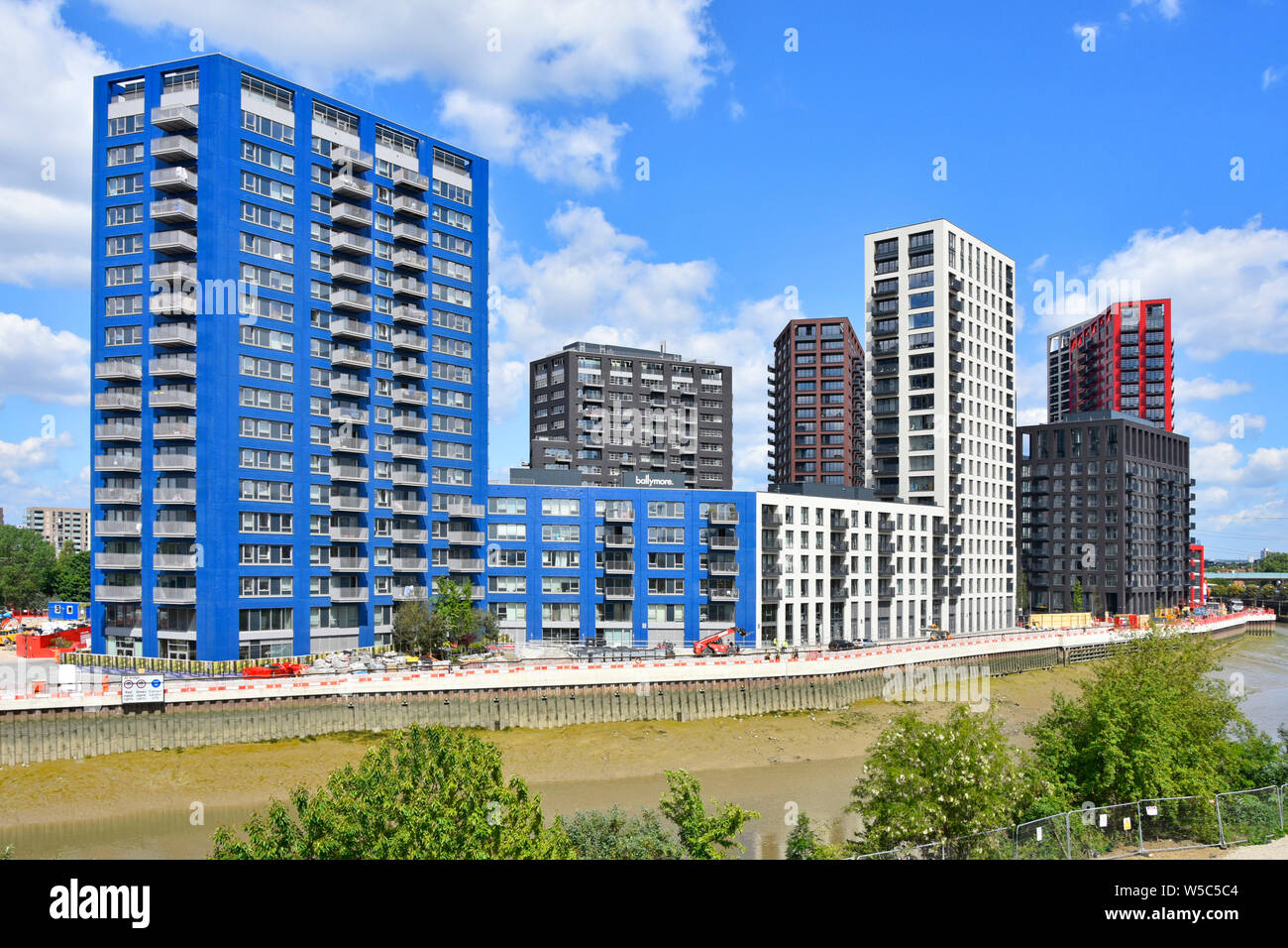 Apartment blocks new homes & offices in urban landscape River Lee creek City Island East London housing brownfield site development Canning Town UK Stock Photo