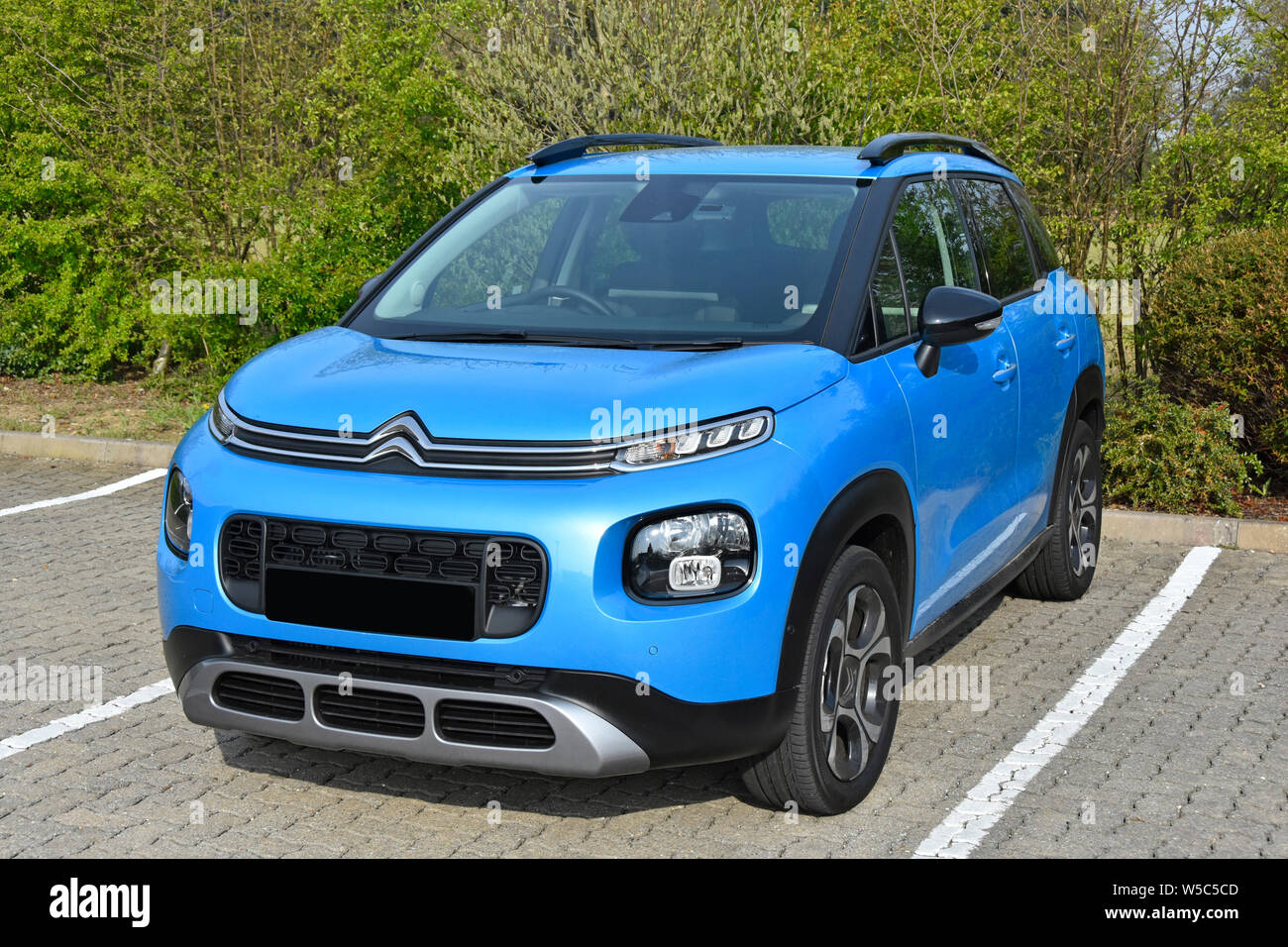 5 door right hand drive hatchback automobile family car front view of new 2019 blue Citroen C3 Aircross mini SUV Flair variant with petrol engine UK Stock Photo