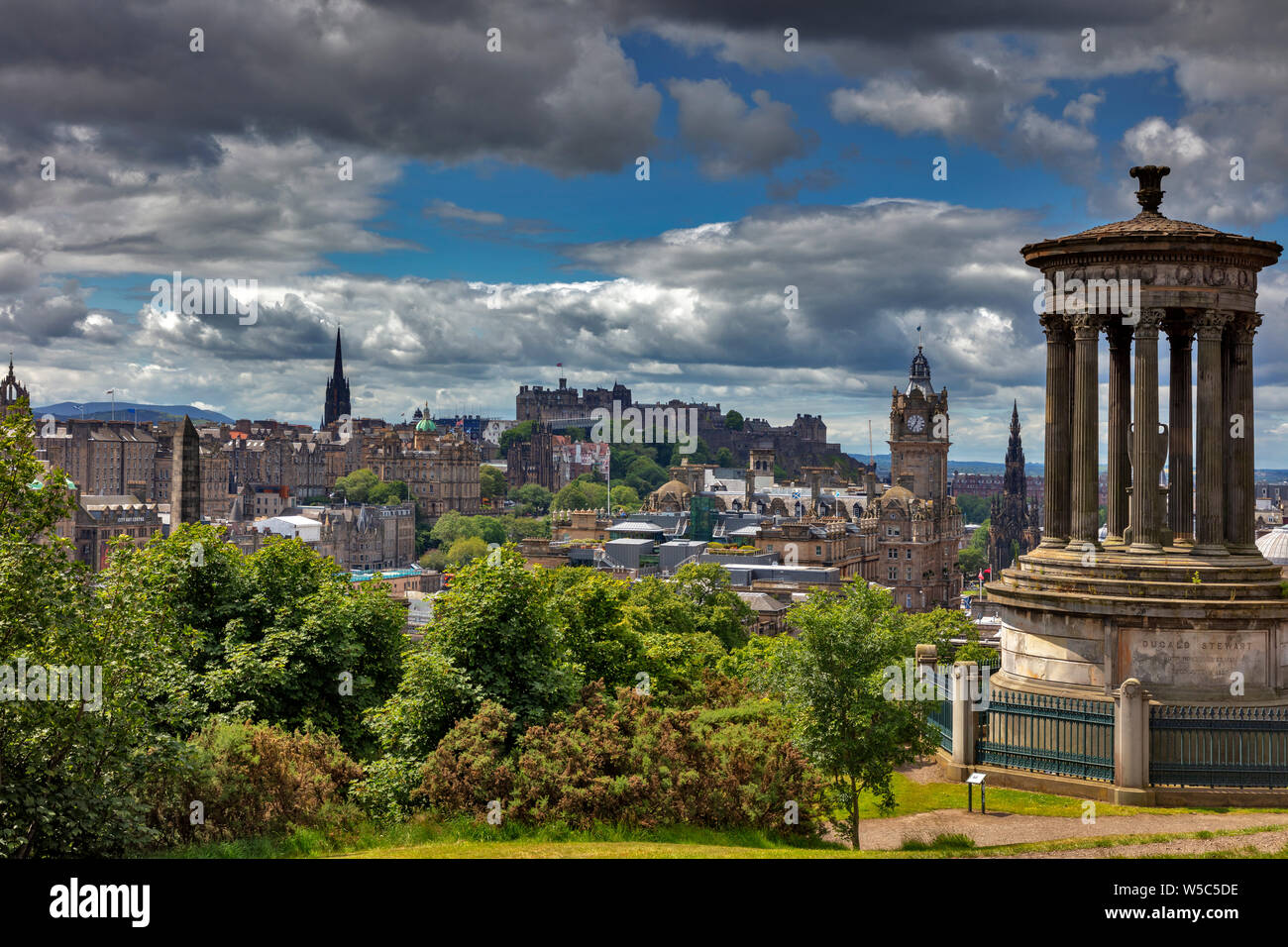 View from Caltoun Hill with the Dugald Steward Monument over the historic old town with Edinburgh Castle, Edinburgh, Scotland, United Kindom Stock Photo