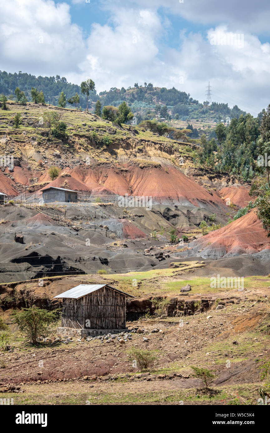 A hillside exposes layers of sediment, Debre Berhan, Ethiopia. Stock Photo