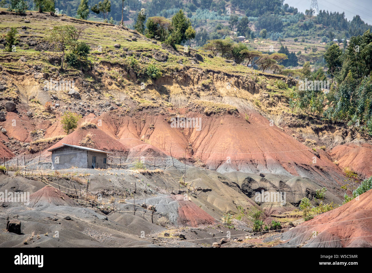 A hillside exposes layers of sediment, Debre Berhan, Ethiopia. Stock Photo