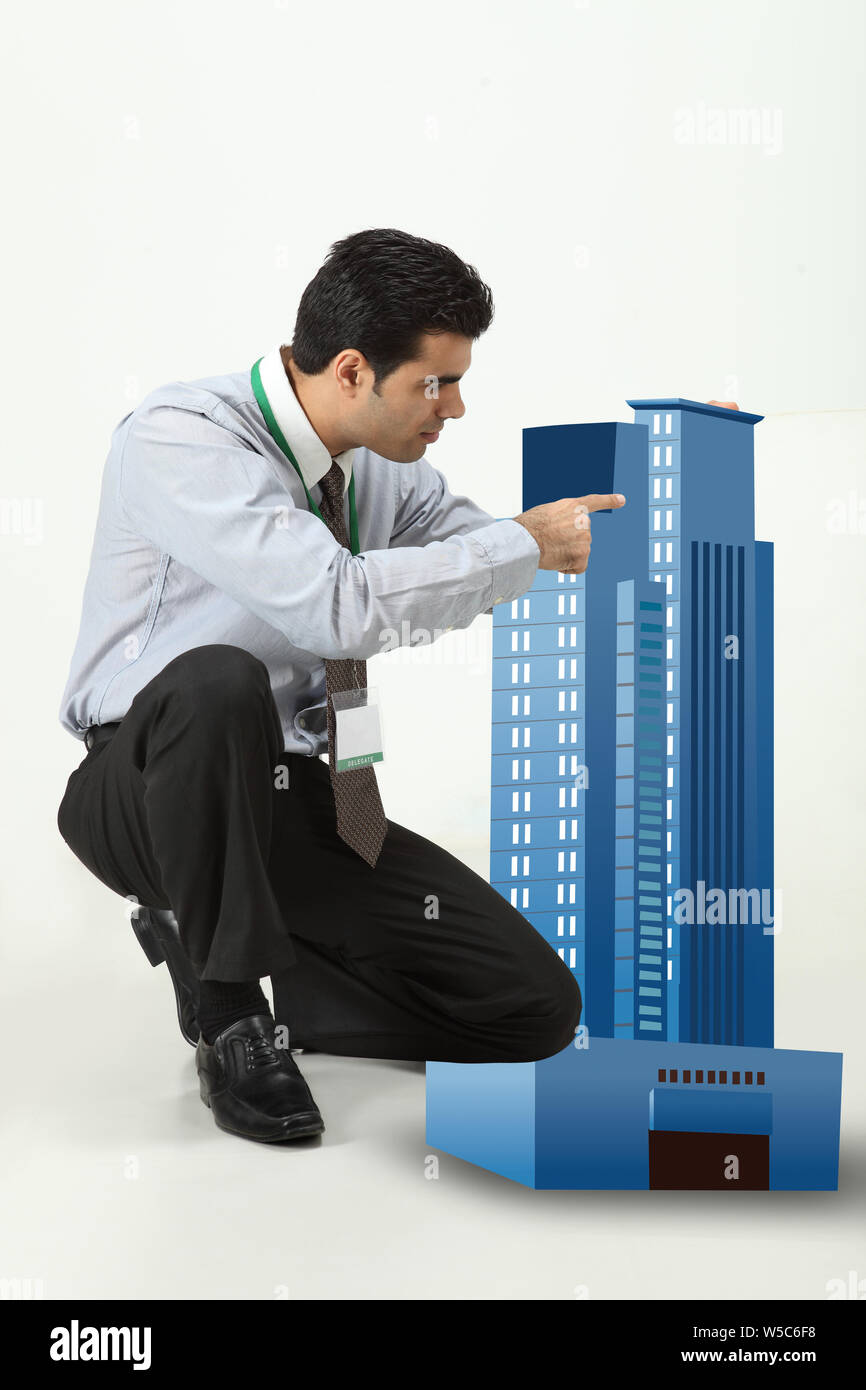 Architect showing building model Stock Photo Alamy