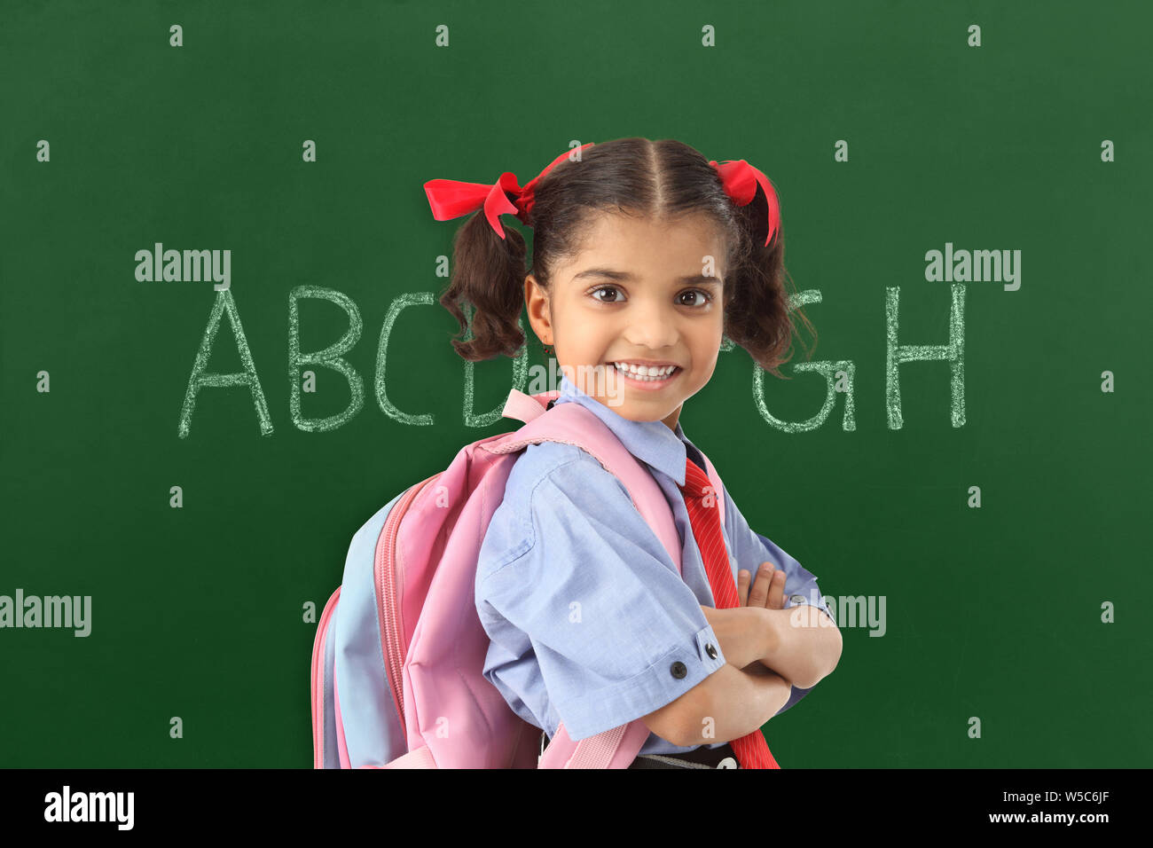 Portrait of a schoolgirl smiling Stock Photo - Alamy