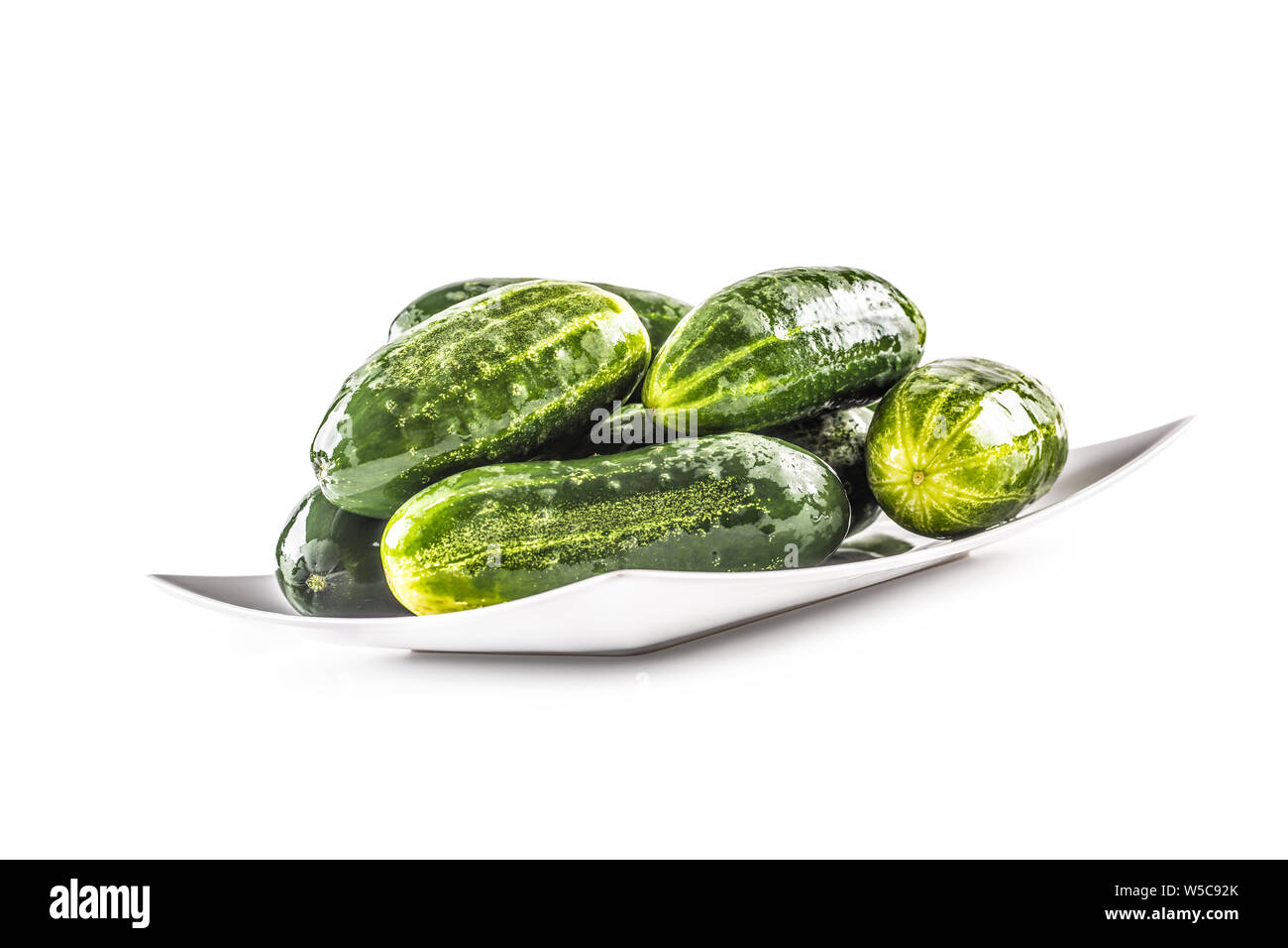 Fresh cucumbers isolated on white background - close-up. Stock Photo