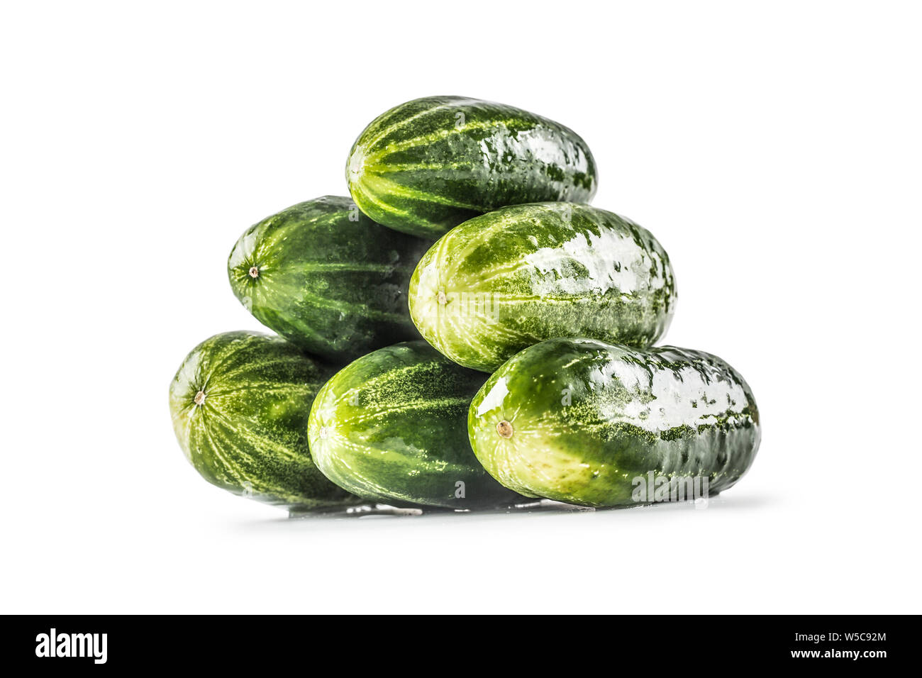 Fresh cucumbers isolated on white background - close-up. Stock Photo