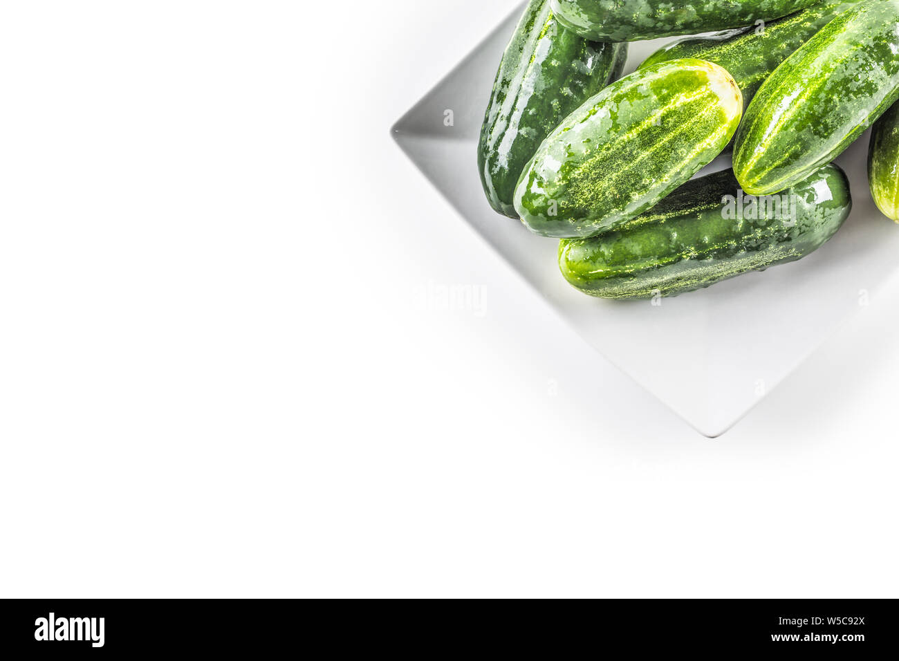 Fresh cucumbers isolated on white background - close-up. Stock Photo
